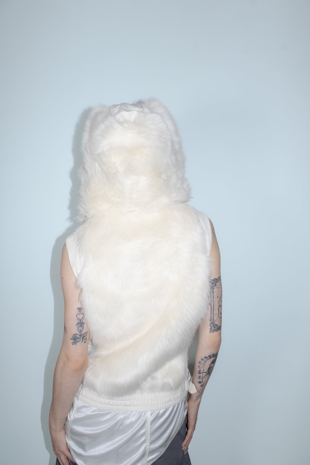 white faux fur vest