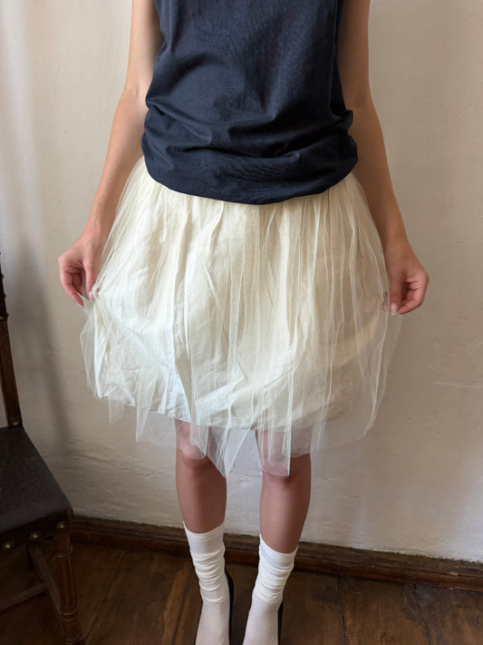 Ivory layered tulle ballet skirt with a softly gathered silhouette and sheer mesh overlay.