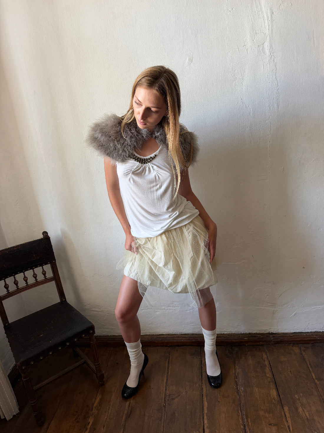 Ivory layered tulle ballet skirt with a softly gathered silhouette and sheer mesh overlay.