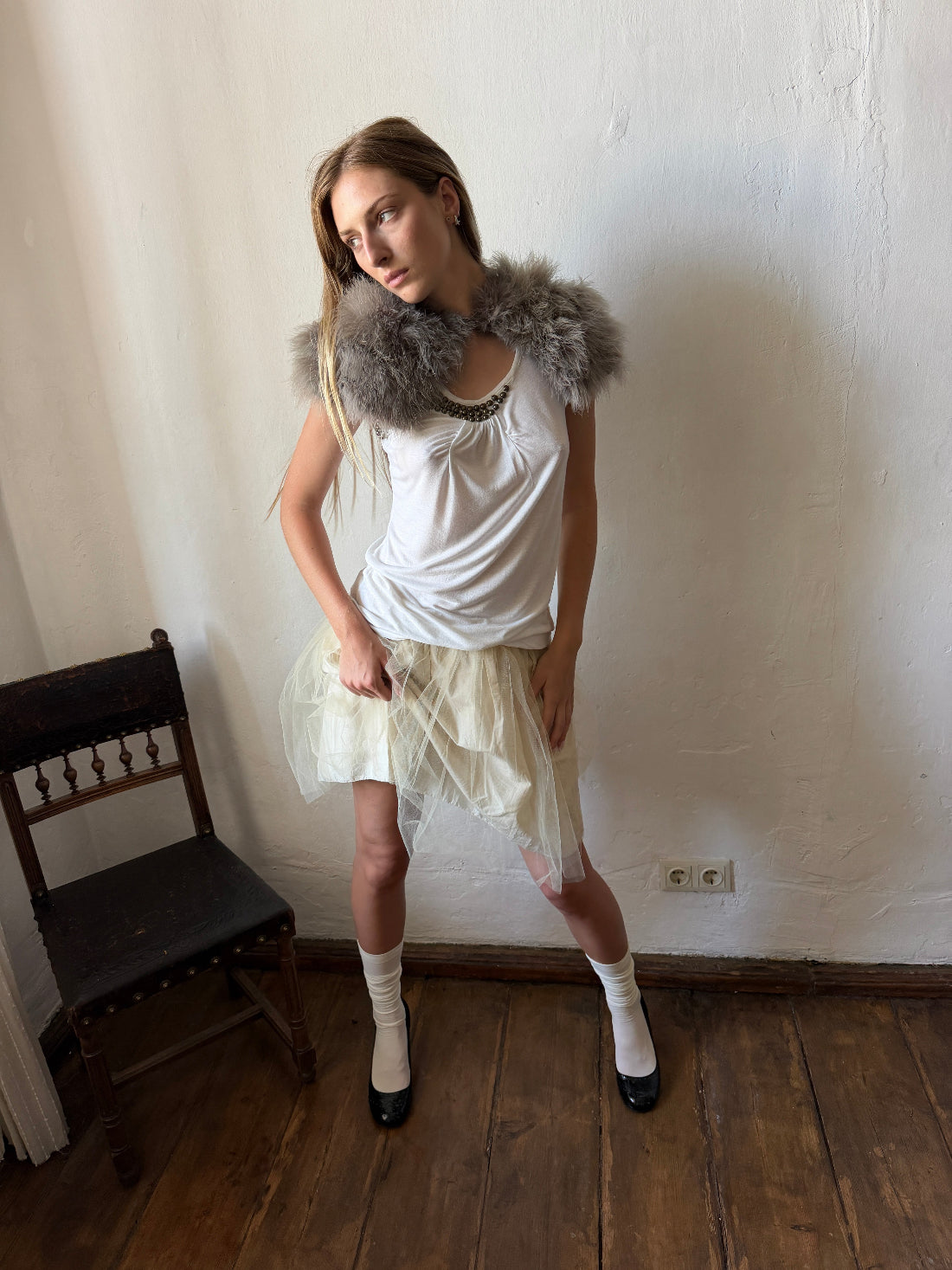 Ivory layered tulle ballet skirt with a softly gathered silhouette and sheer mesh overlay.