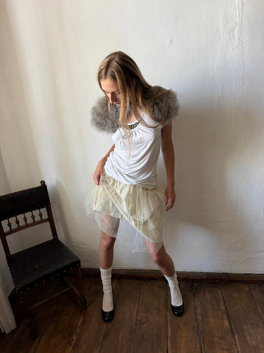 Ivory layered tulle ballet skirt with a softly gathered silhouette and sheer mesh overlay.